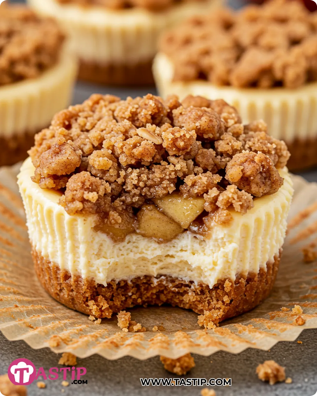 Mini Apple Crisp Cheesecake with graham crust, apples, and oat streuse