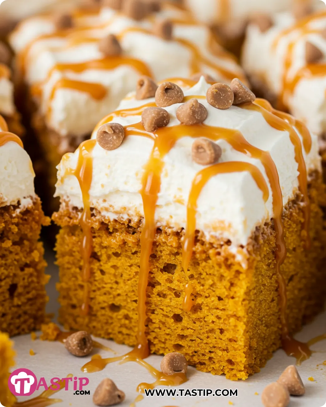 Pumpkin Poke Cake with caramel pockets and cream topping
